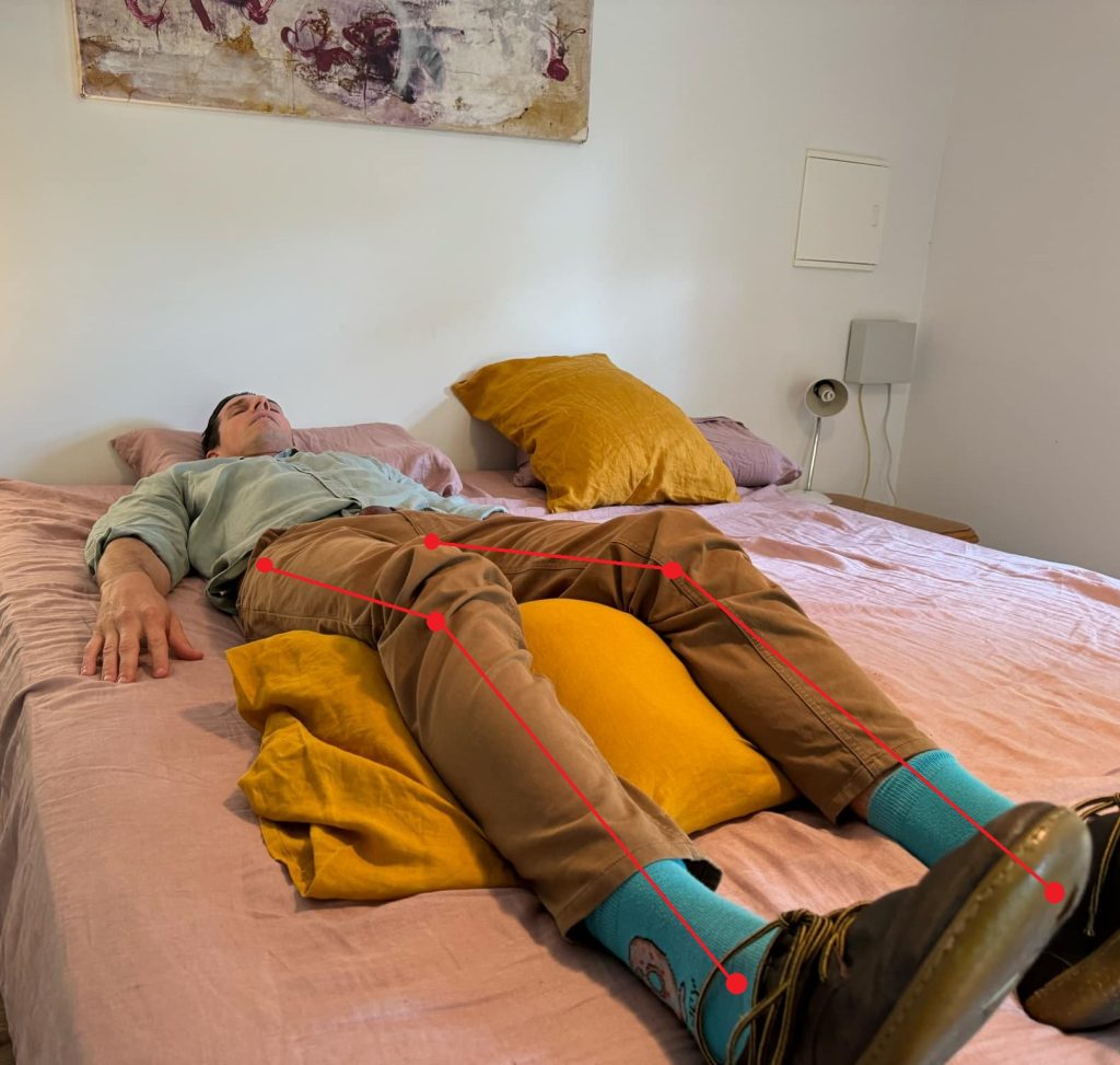 picture of a man sleeping on back